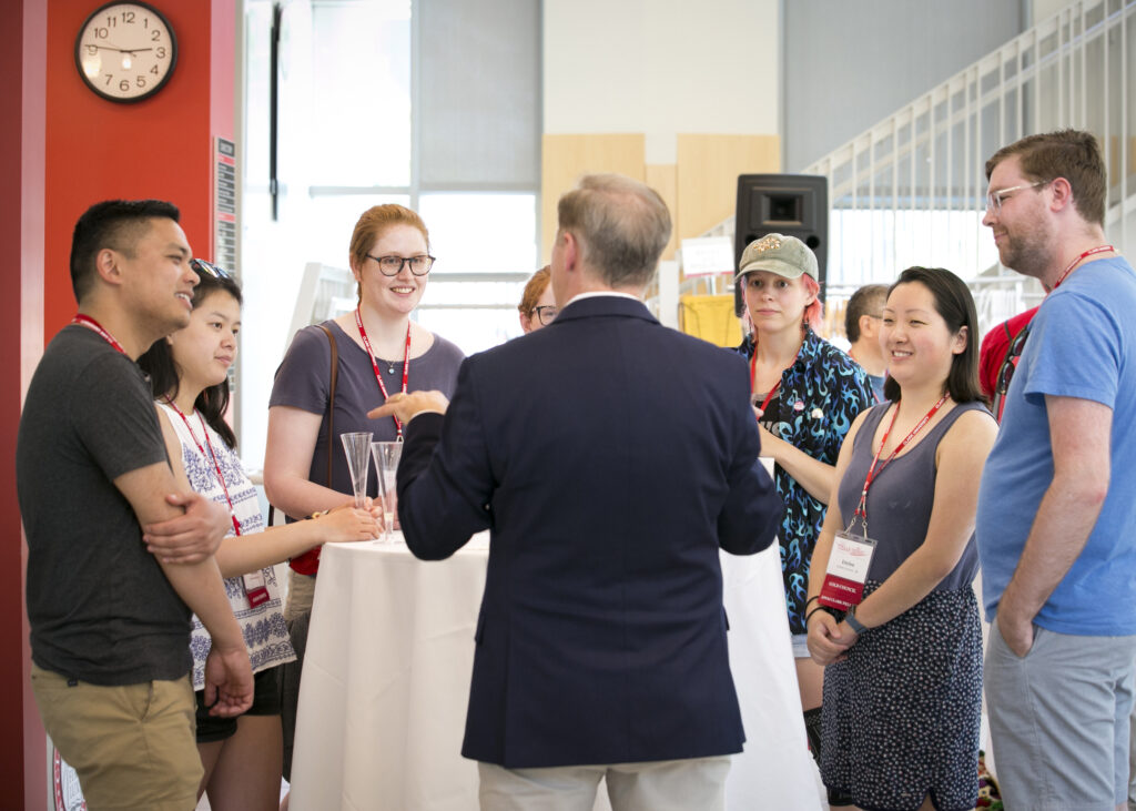 People talking during LGBTQ+ Alumni Reunion Reception