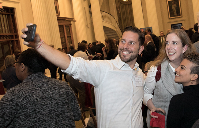 alumni members taking selfies