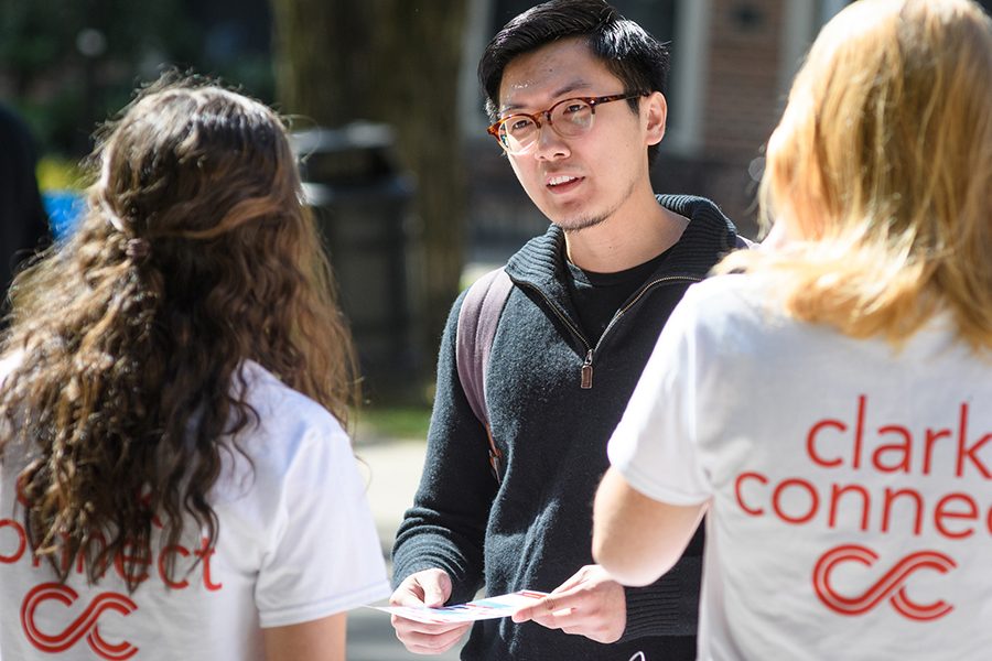 alumni member with clark connect t-shirts on