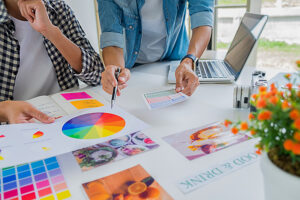 branding concepts - Team advertising designer creative start-up team discussing ideas in office.