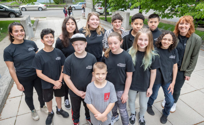 young k-12 students posing for camera