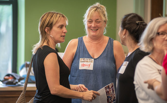 Teachers talking at Hiatt event