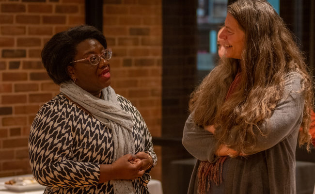 Katerine Bielaczyc talking to another teacher at Hiatt Event