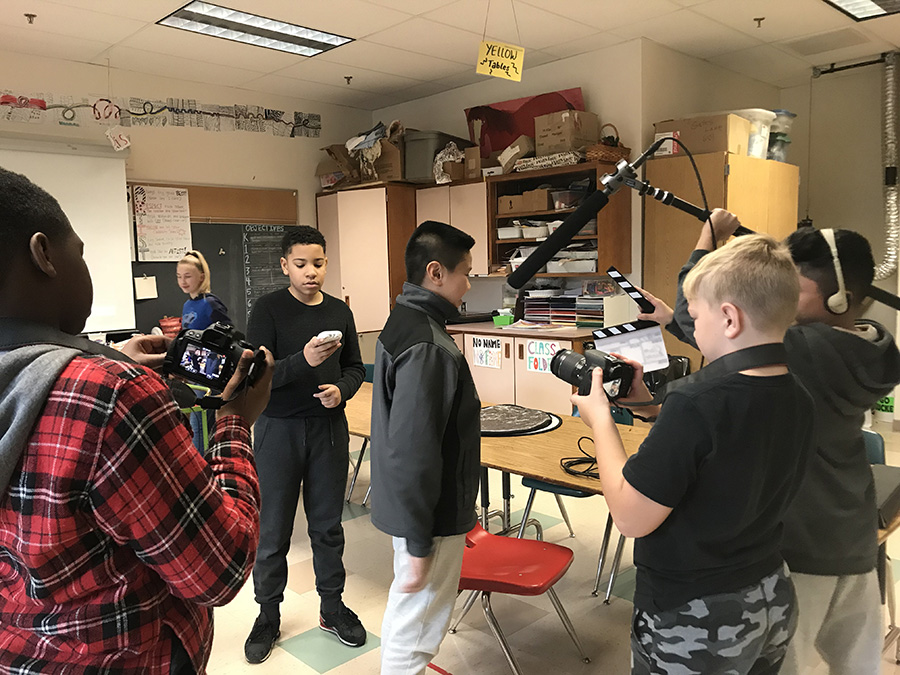 young students mocking a video screen shot