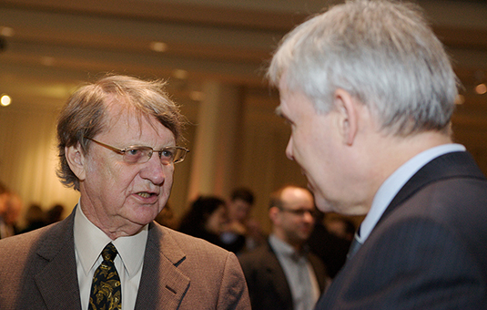 Roger Kasperson talks to David Angel, president of Clark Univ