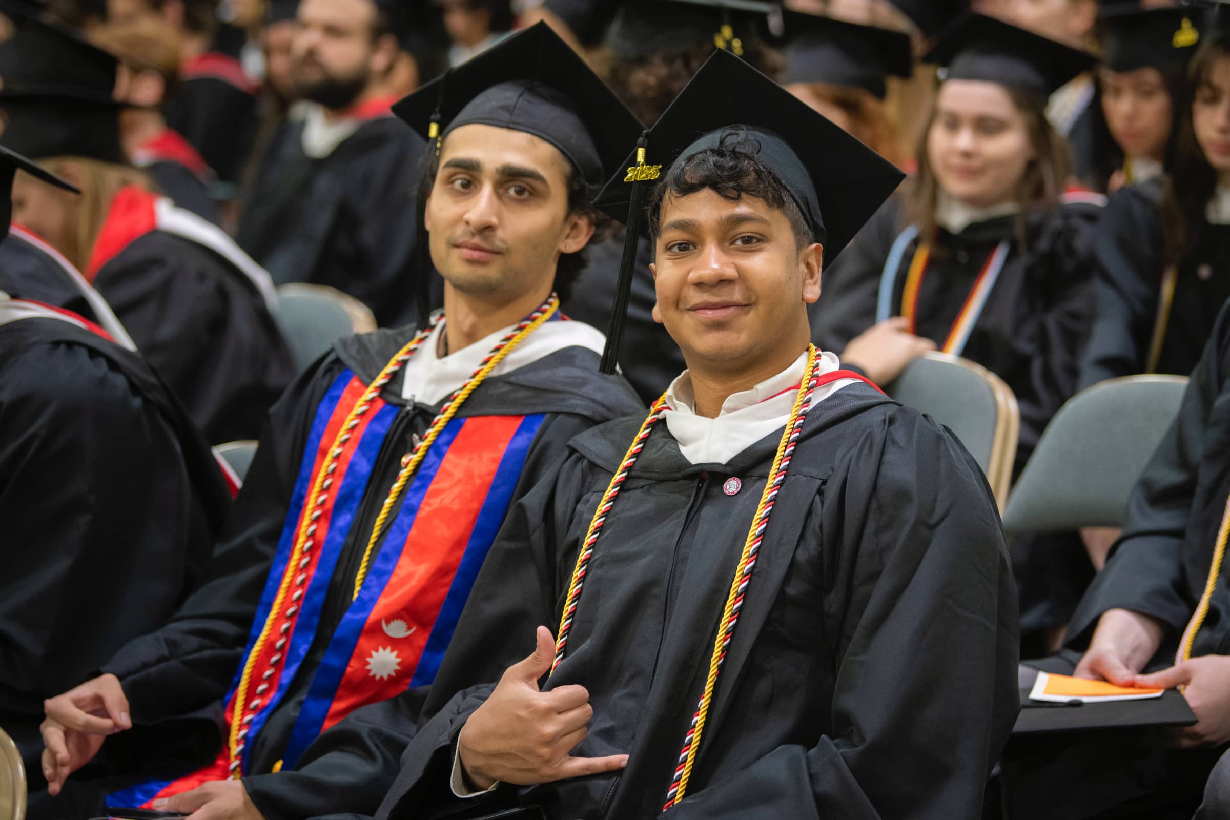 graduates pose for the camera