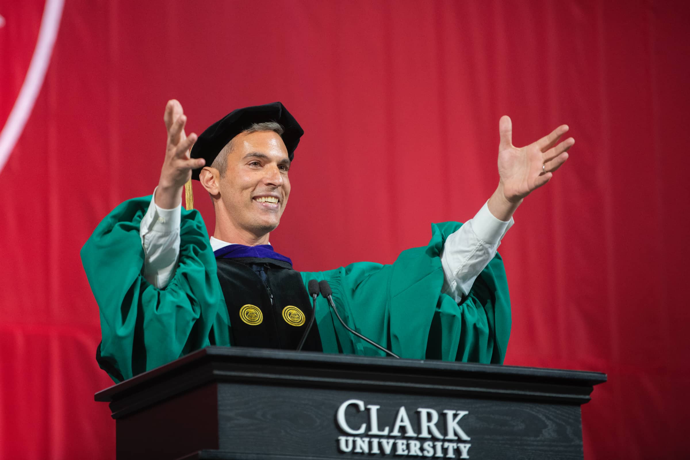 The graduate speaker addresses the room