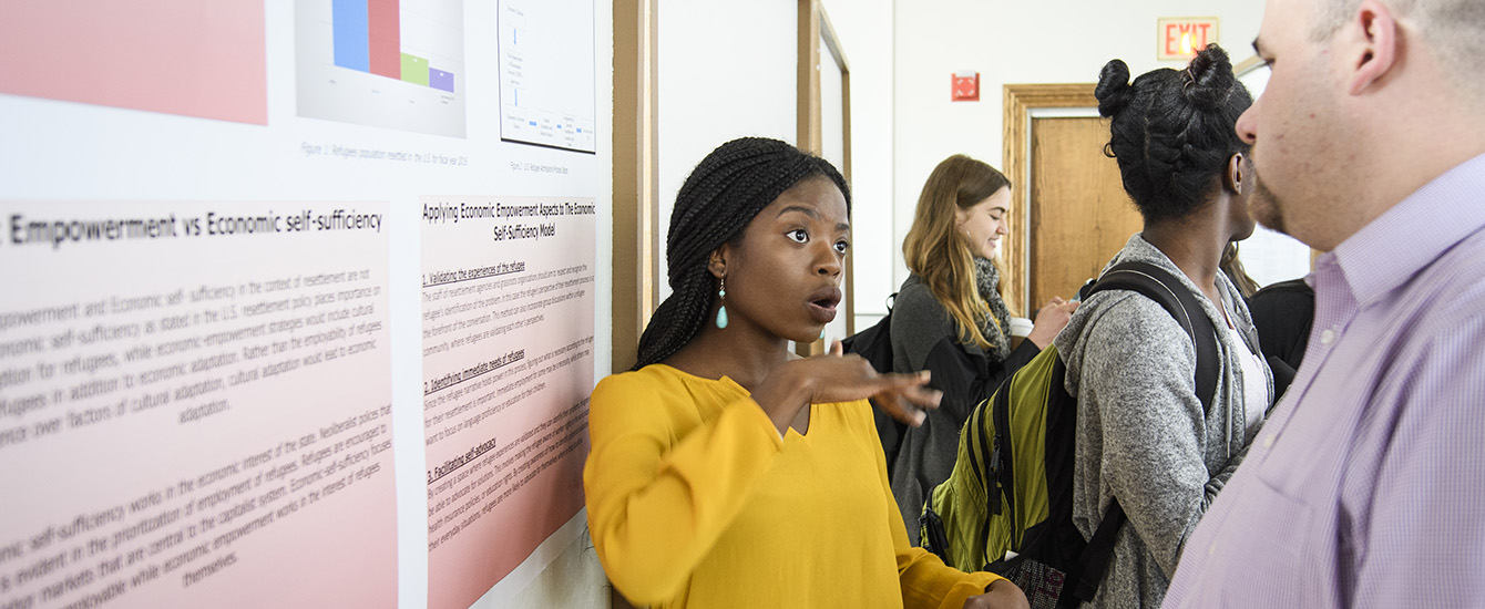 Student presenting poster