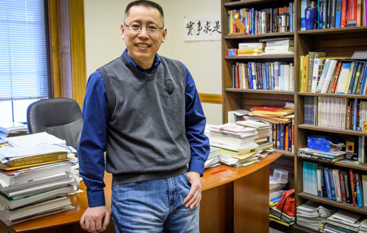 Junfu Zhang in his office