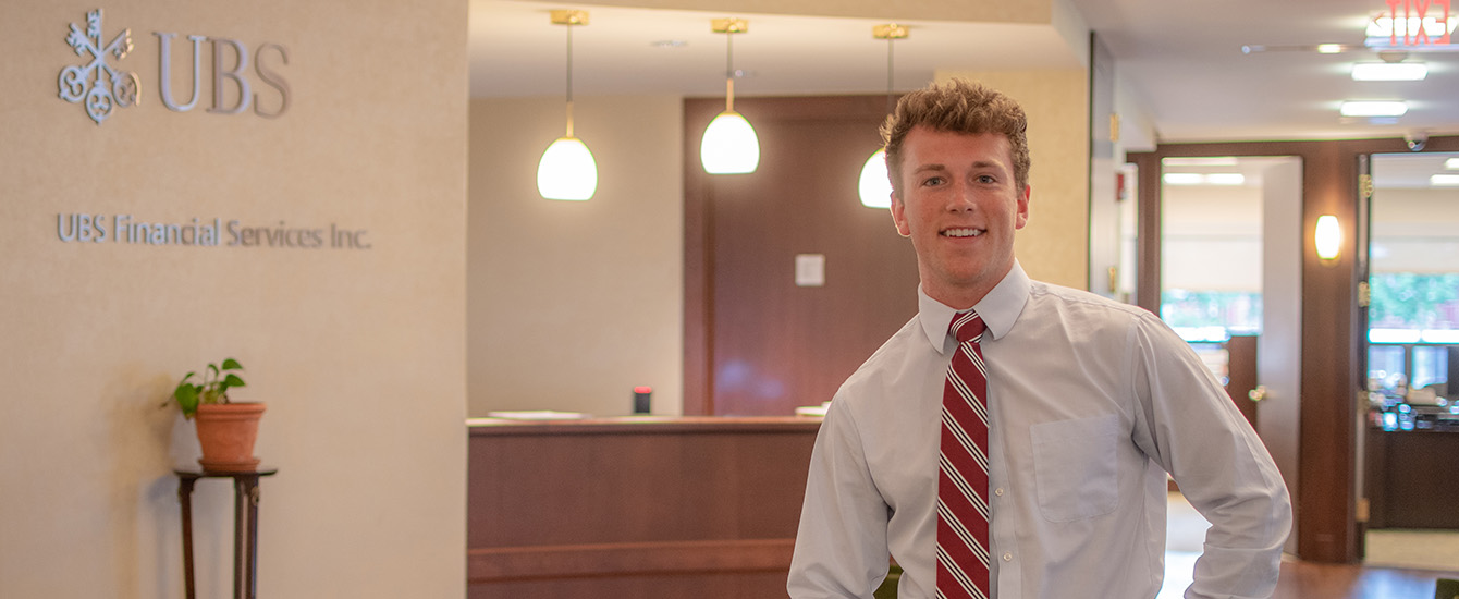 Student intern standing near desk