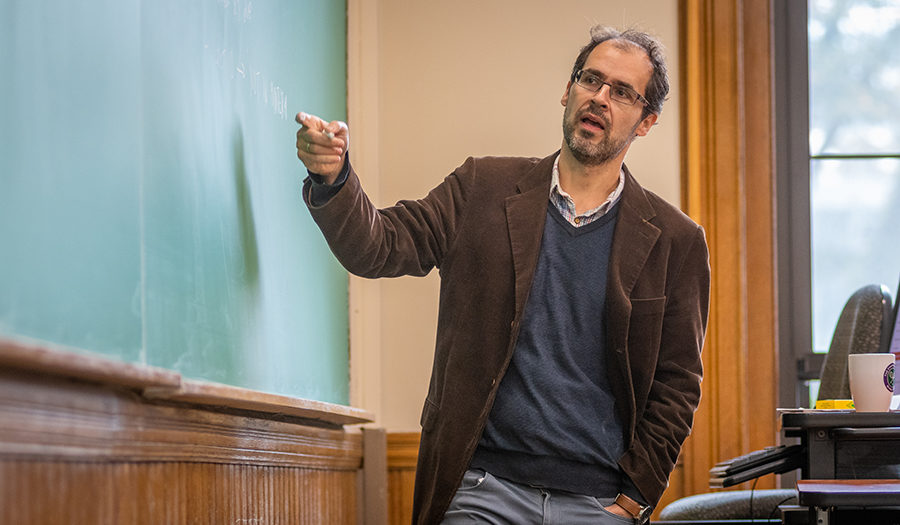 David Cuberes teaching at the blackboard