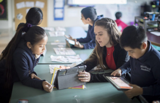 young teacher working with young children