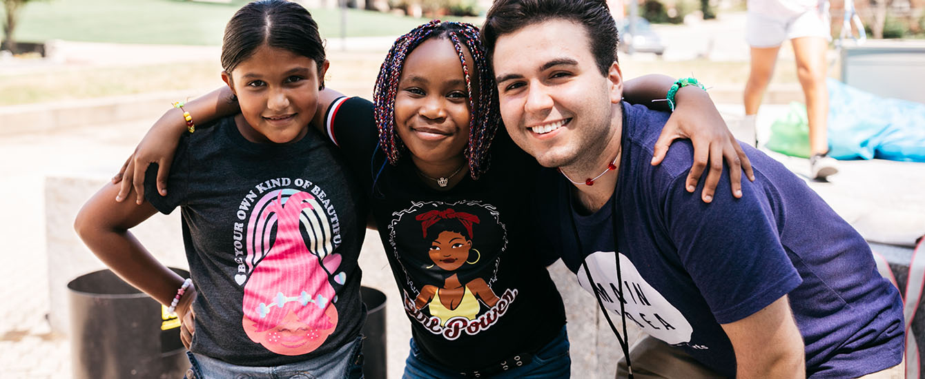 Education student with two children from neighborhood schools
