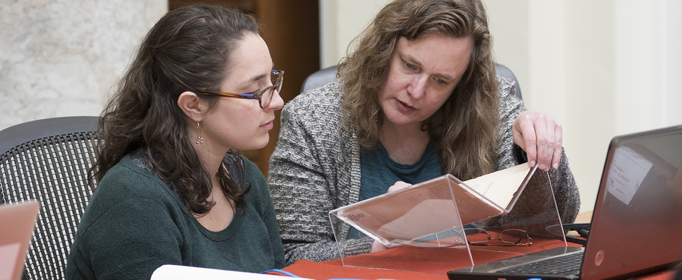 students and faculty working in library