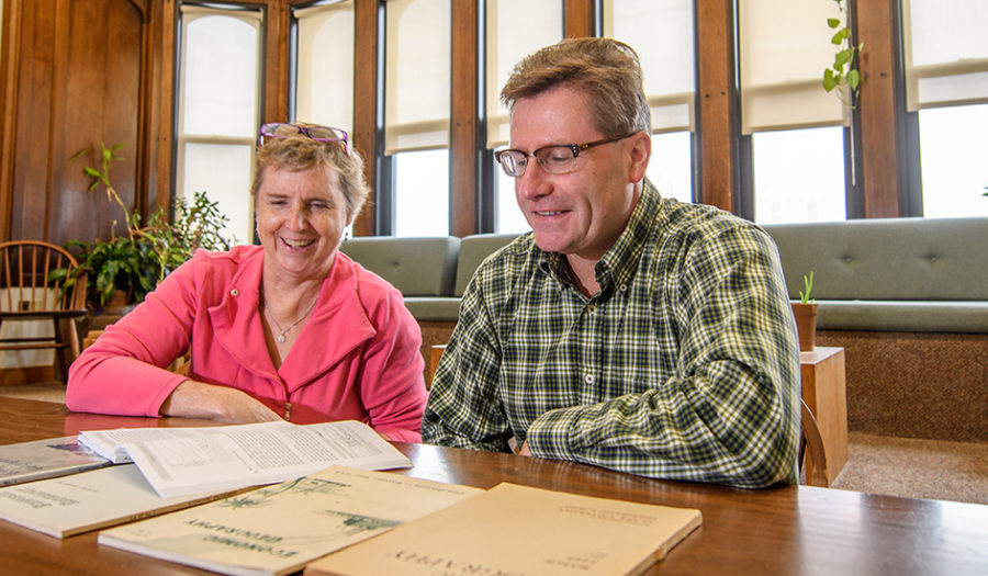 Professors looking over books for Urban Economic Geography