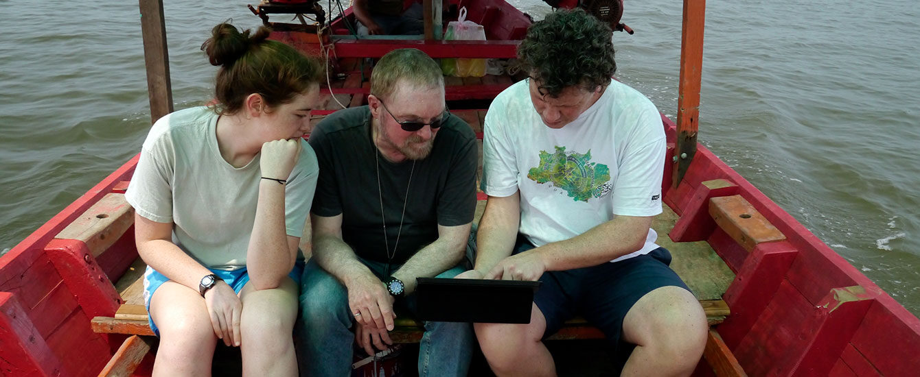 Ron Eastman with students on boat