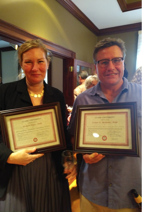 Karen Frey and Jim Murphy holding awards