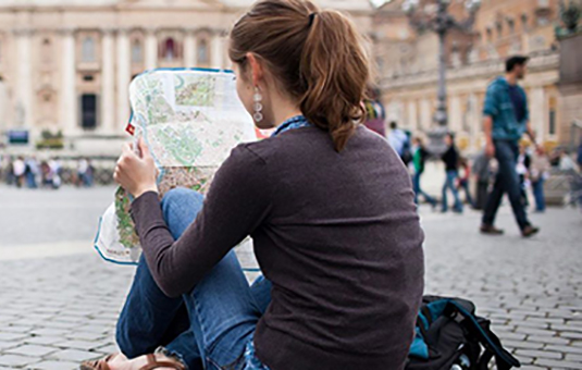 Student looking at map