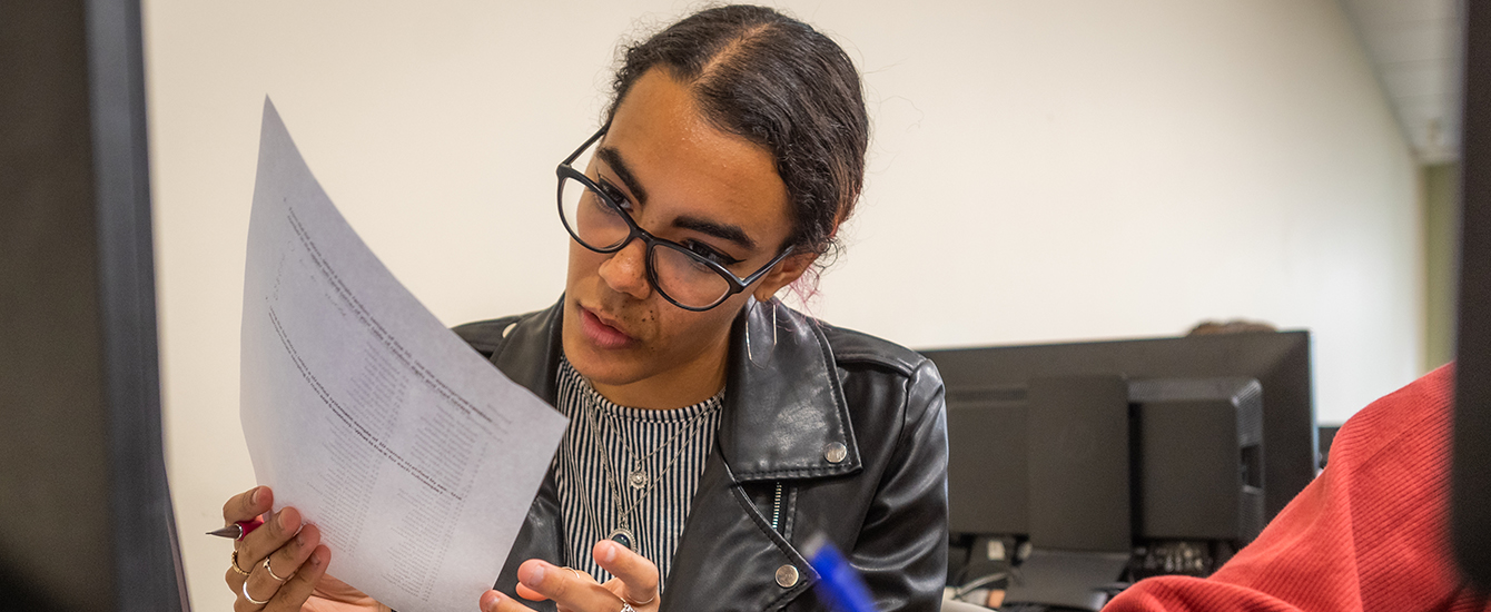 girl looking over papers