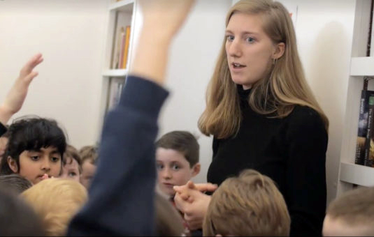 Student working with children