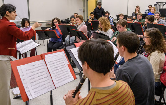 Concert band practicing inside