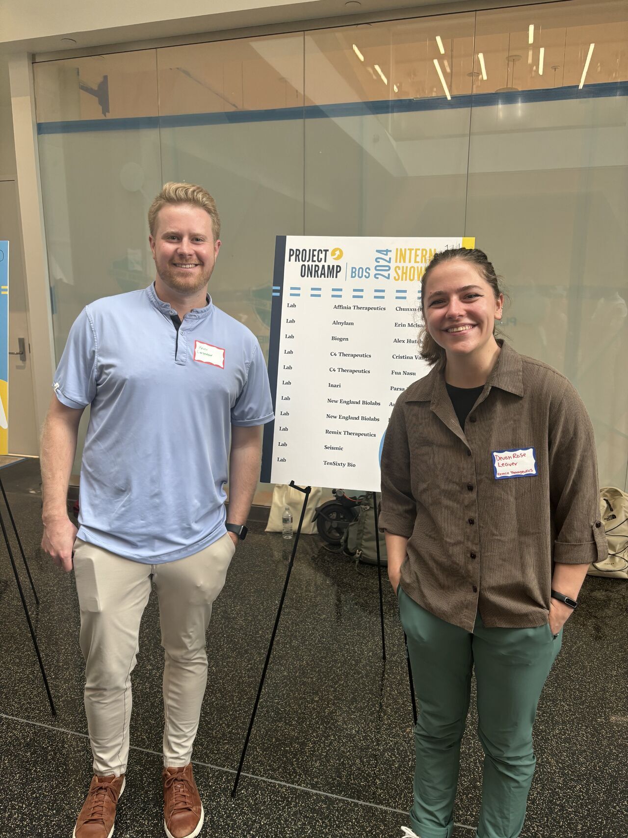 Devon Rose Leaver and a colleague at a conference during her internship in a biomolecular and science lab at Remix Therapeutics