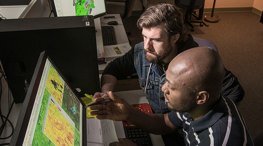 two students as desktop computer for gis mapping