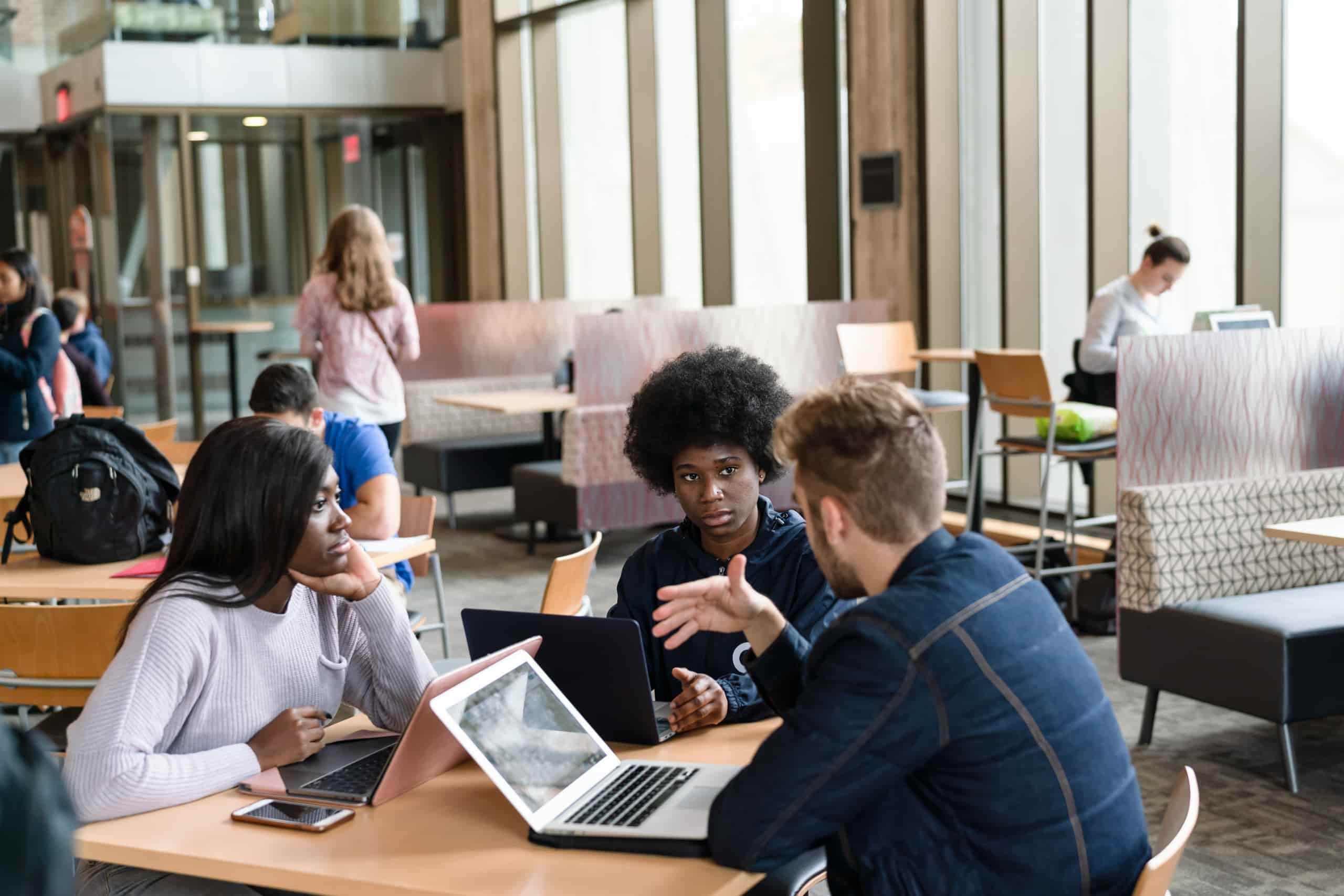 students collaborating in the library