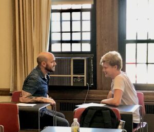 CULEP partners chatting seated in a classroom