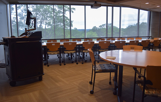 fuller music room with large amount of chairs and tables