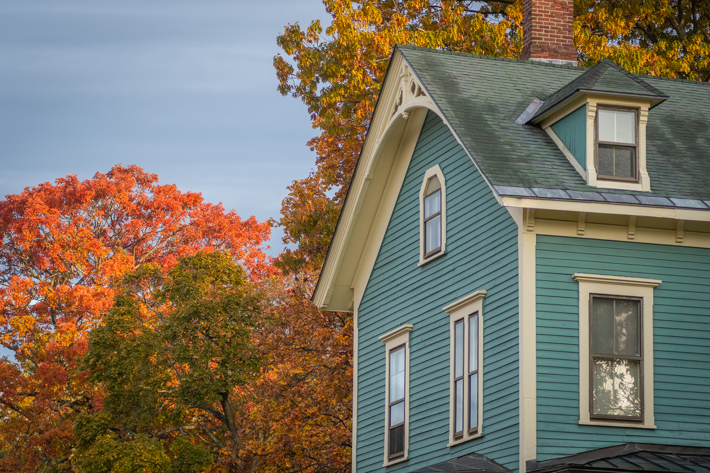 Corner House with fall leaves