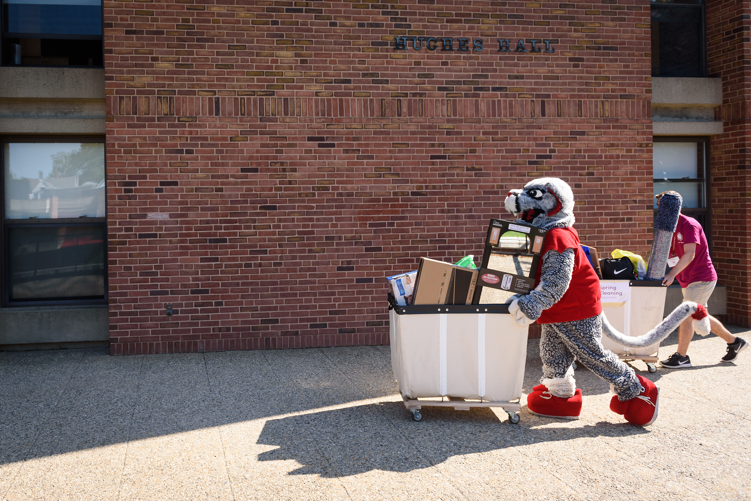 Hughes Hall - mascot helping move in
