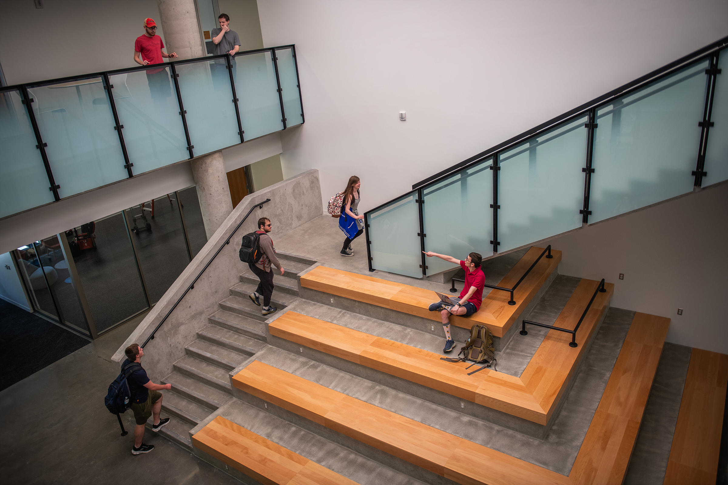 Center for Media Arts, Computing, and Design Building - student sitting on staircase