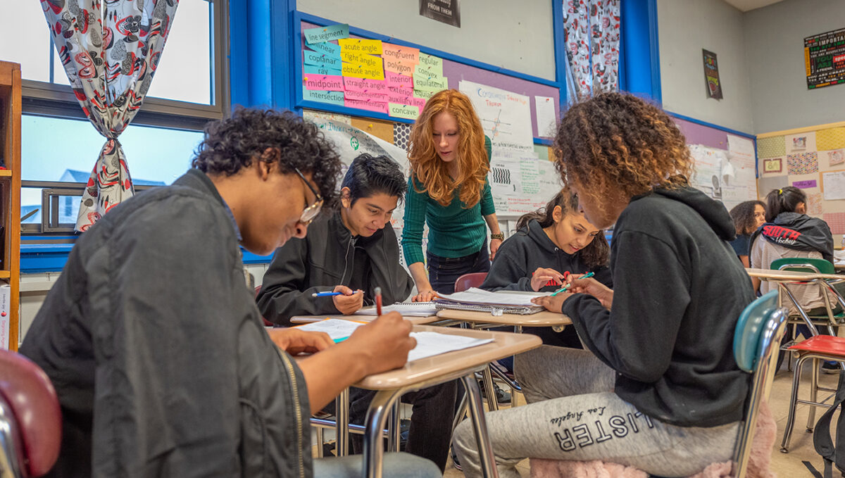 University Park Campus School students work with a teacher in the class