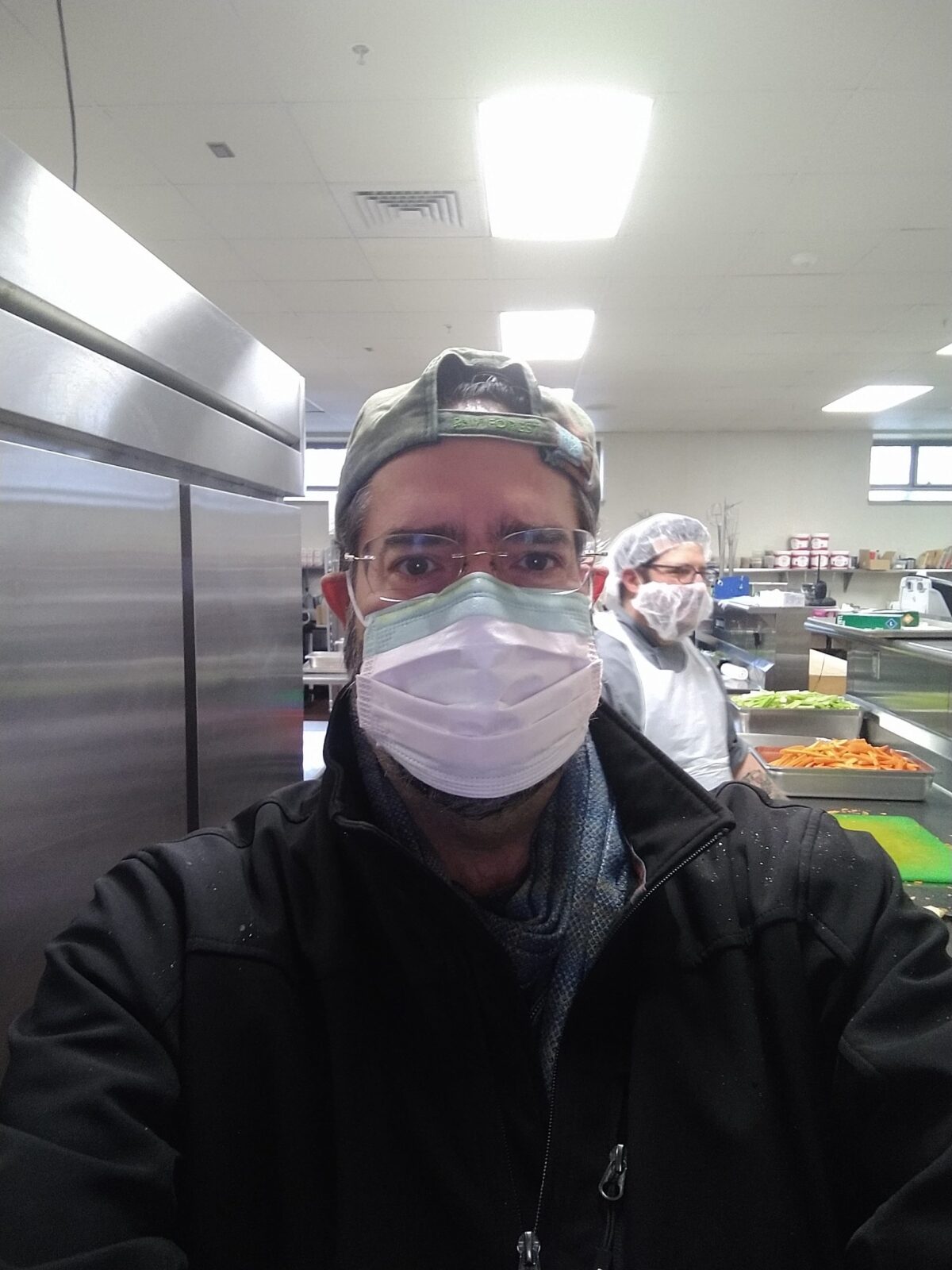 Ramón Borges-Méndez in mask to prepare meals for Worcester schools nutrition program