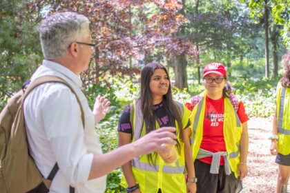 professor and students in woods