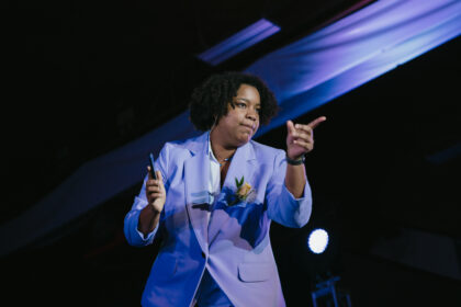 MiKayla Dotson co-hosting Gala in purple suit