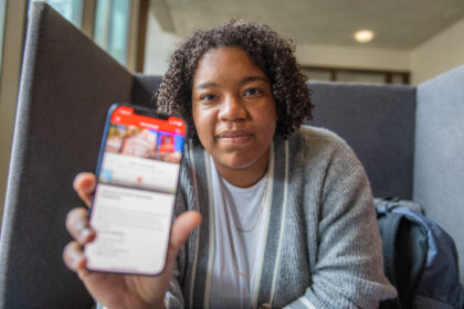 MiKayla Dotson displays the Clark University Guide app