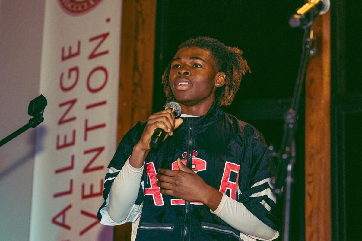 Student sings into microphone