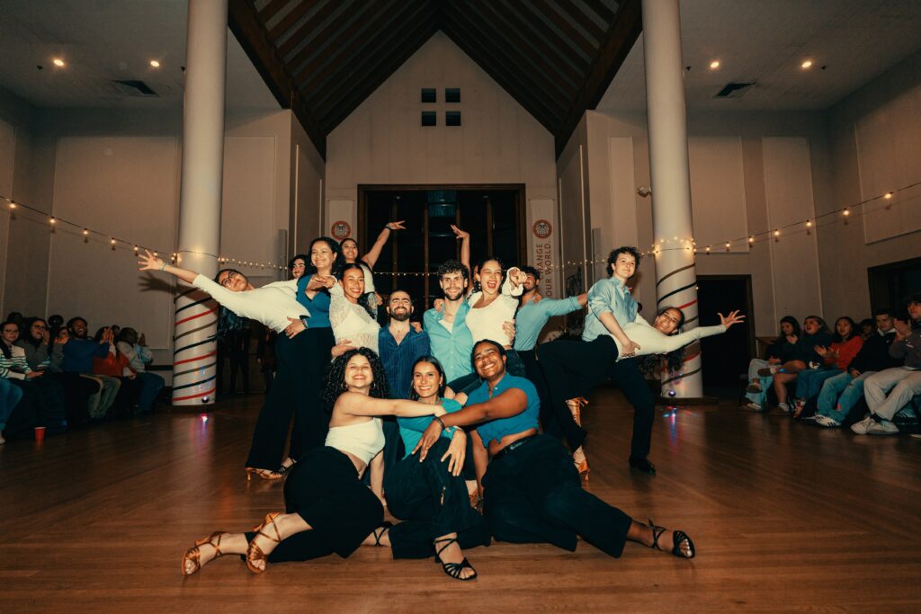 salsa dancers perform in hall