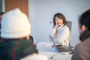 professor sitting at table