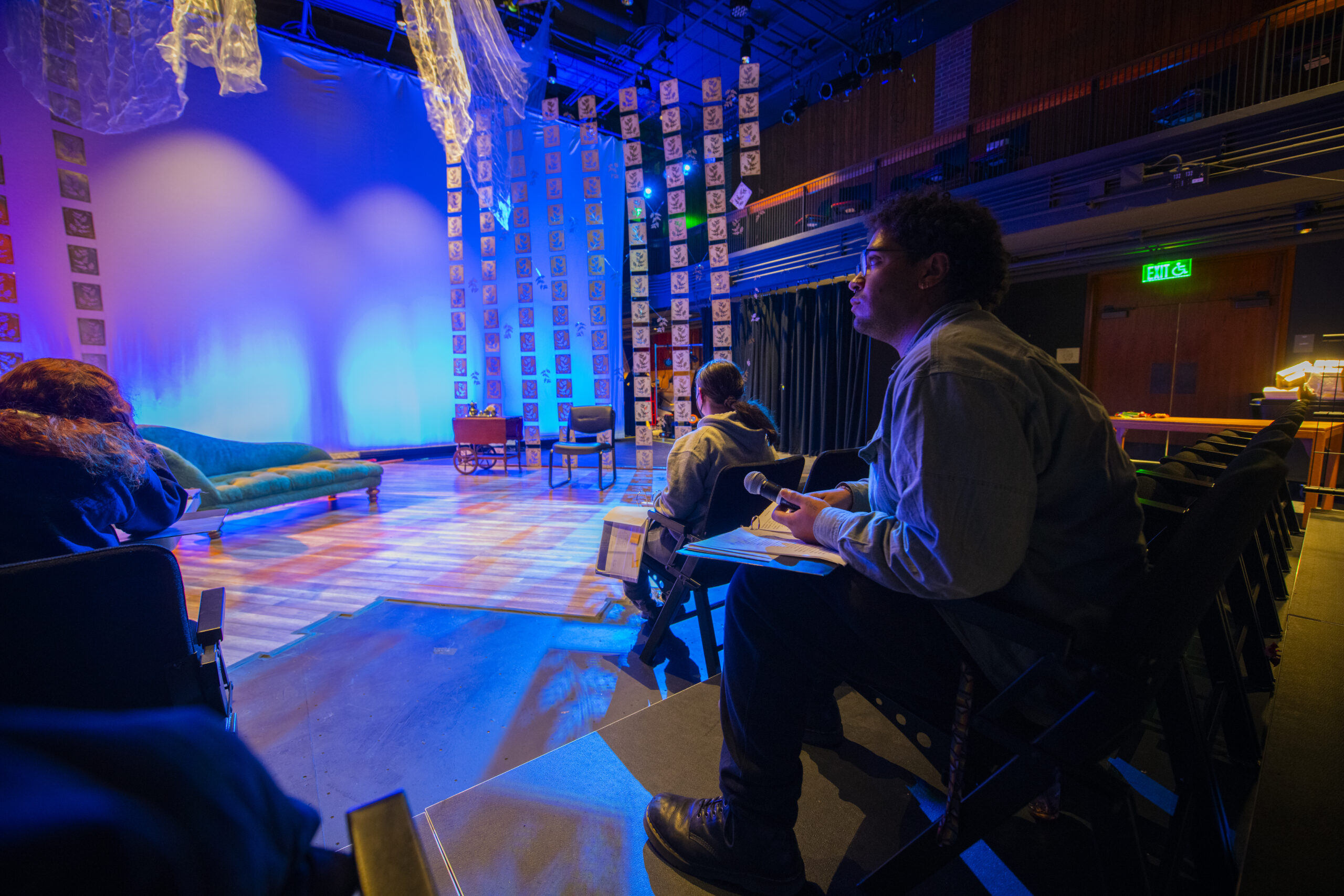 student rehearsing play on stage