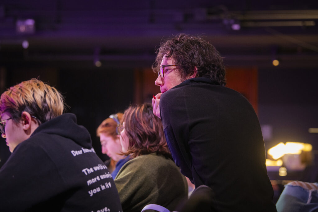 people look at stage during performance rehearsal