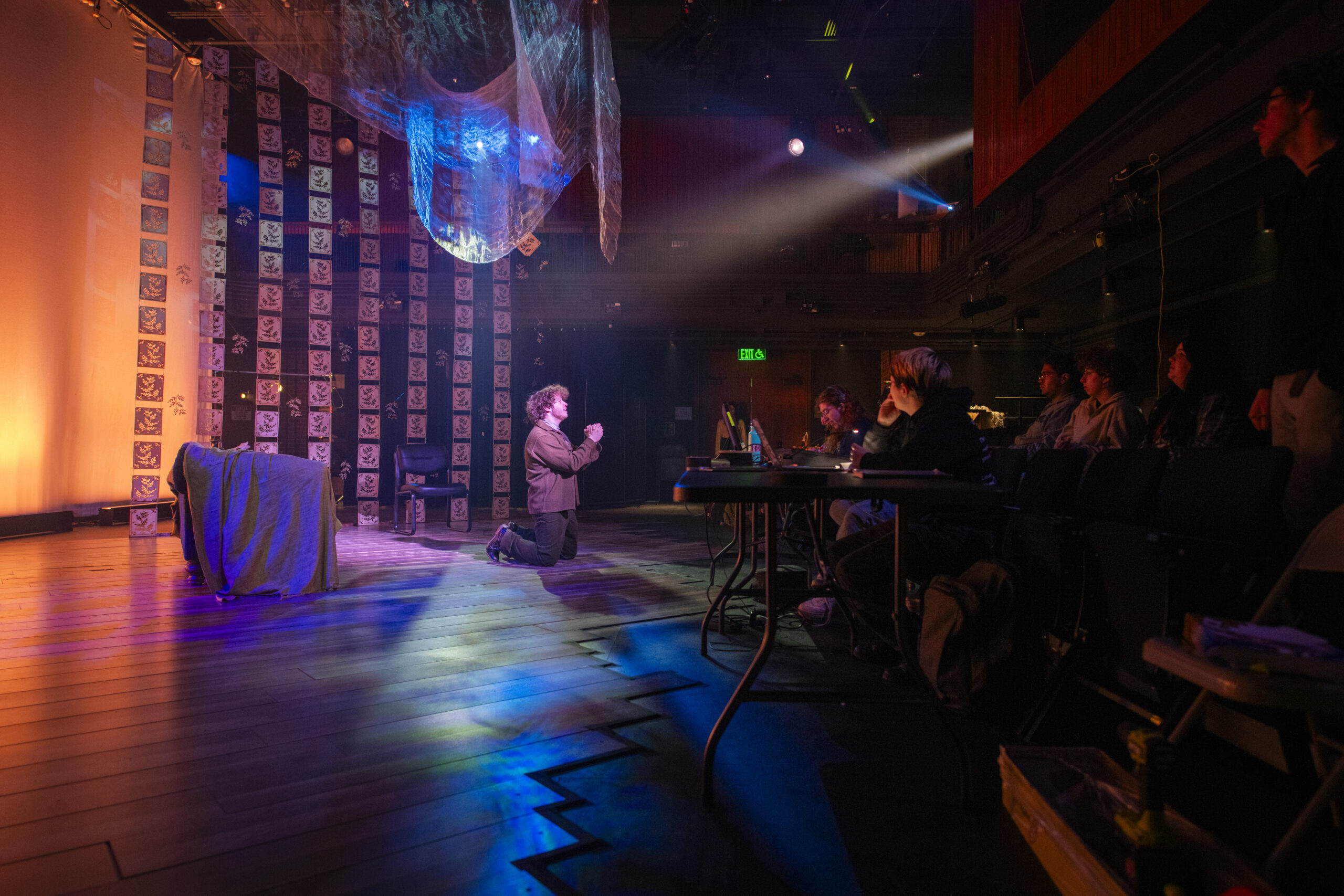 student rehearsing play on stage