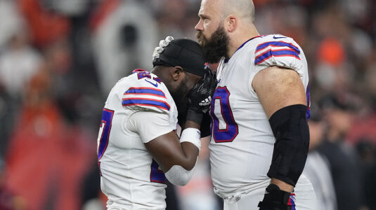 CINCINNATI, OHIO - JANUARY 02: Tre'Davious White #27 and Mitch Morse #60 of the Buffalo Bills react to teammate Damar Hamlin #3 collapsing after making a tackle against the Cincinnati Bengals during the first quarter at Paycor Stadium on January 02, 2023 in Cincinnati, Ohio. (Photo by Dylan Buell/Getty Images)