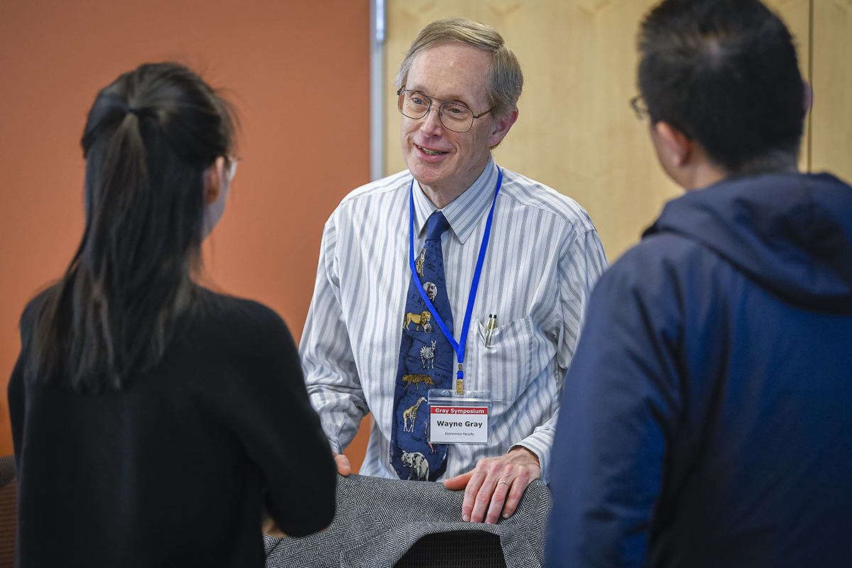 Wayne Gray with well-wishers at the economics symposium