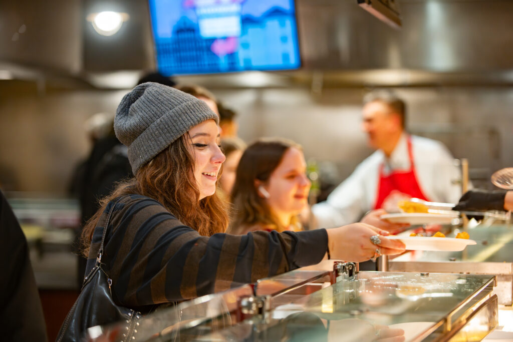 students are served breakfast food in cafeteria