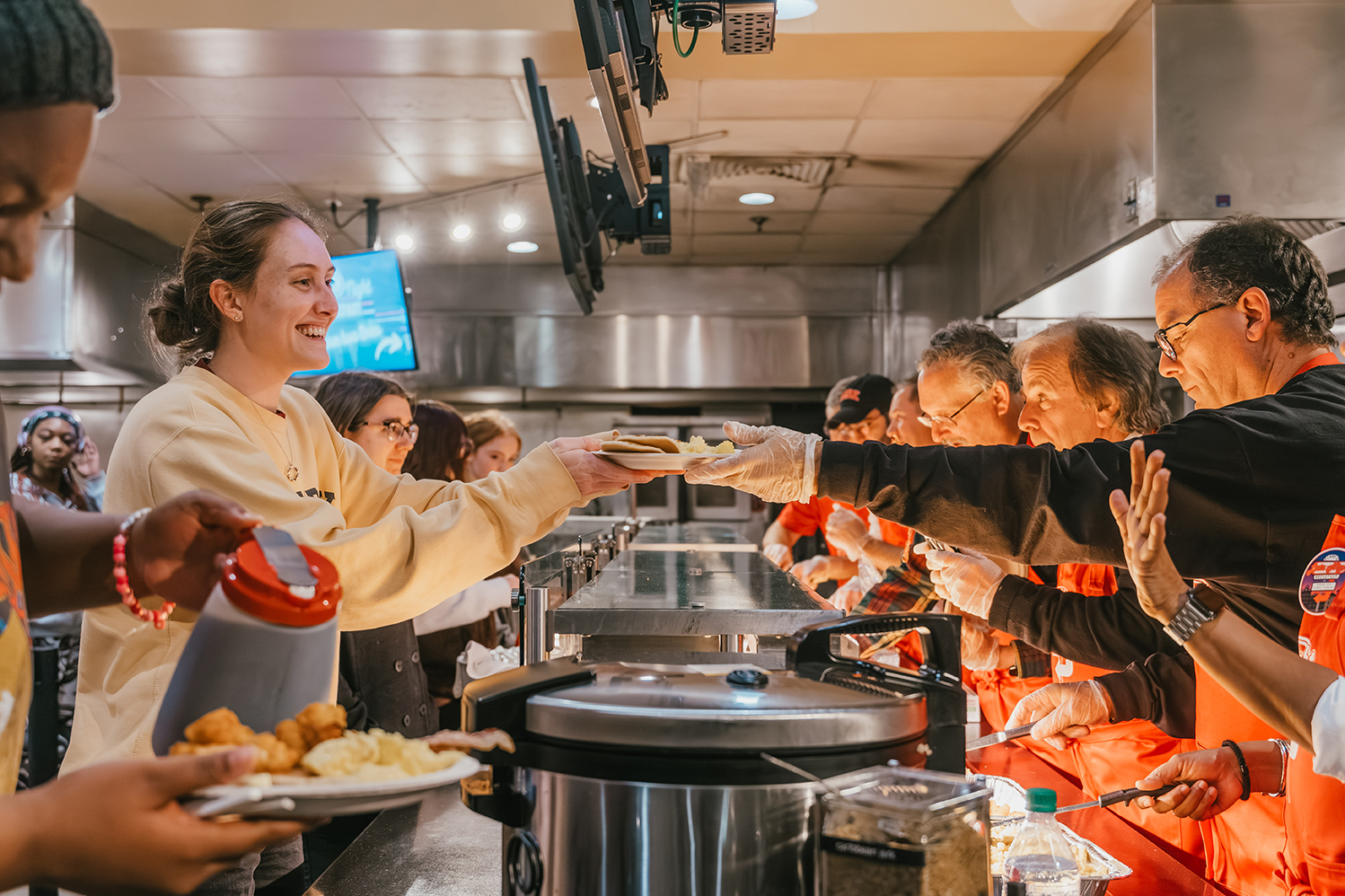 Administrators serve students at fall 2023 Late Night Breakfast