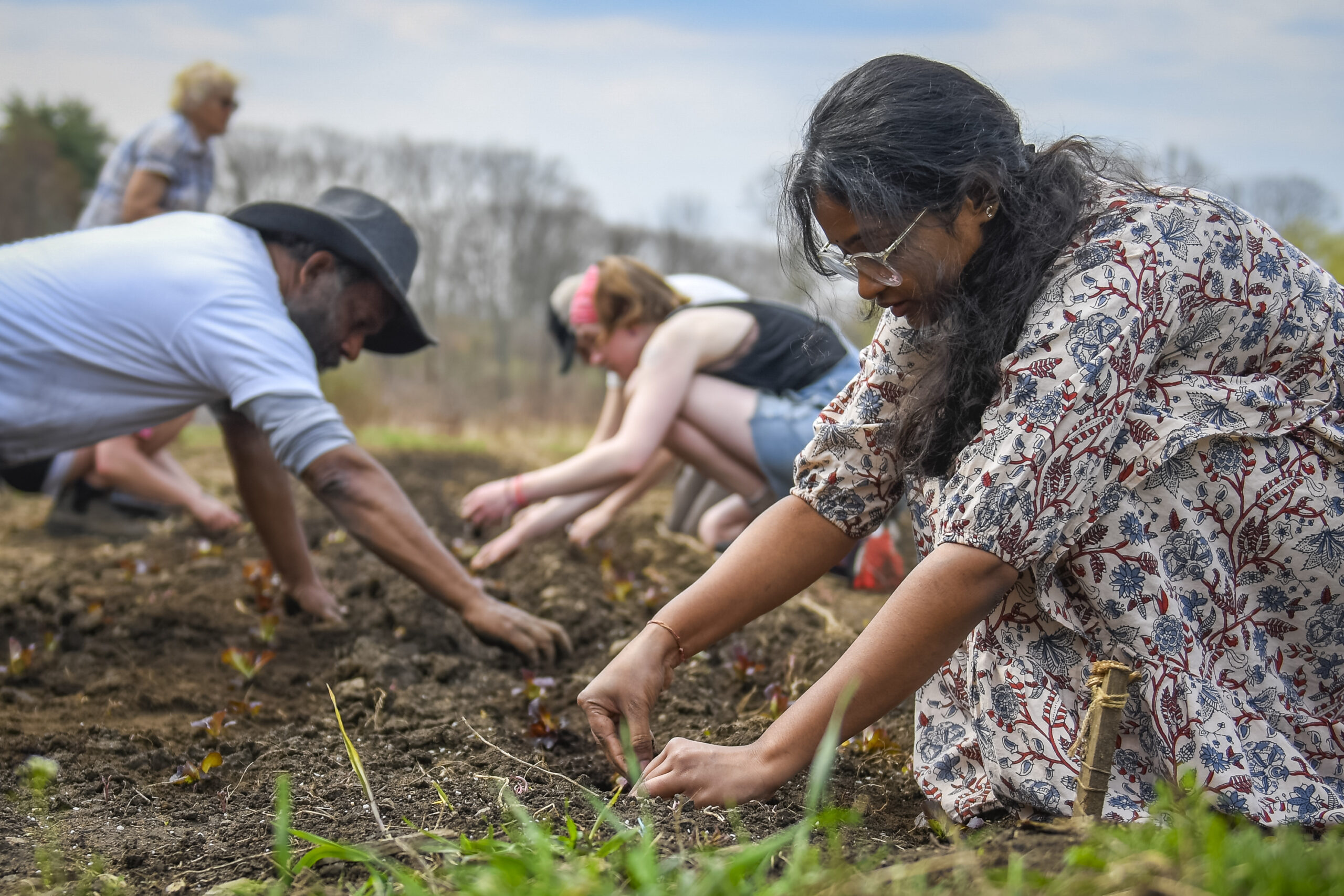students work on farm