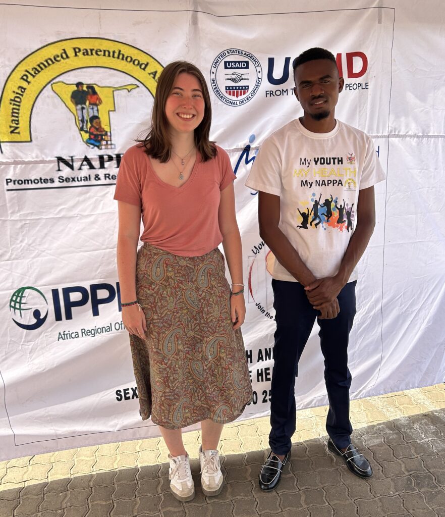 two people pose for photo